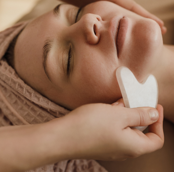 How to Sculpt, Lift, and De-Puff Your Face with a Lymphatic Massage